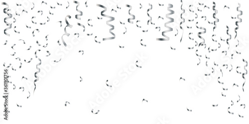 White background with falling serpentine and ribbons. Image for fun, party, celebration. Horizontal colorful template. Stock Photo.