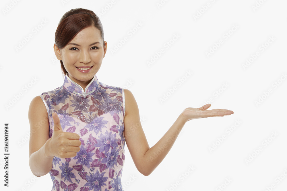 Woman in traditional clothing showing hand gesture Woman in traditional clothing showing hand gesture