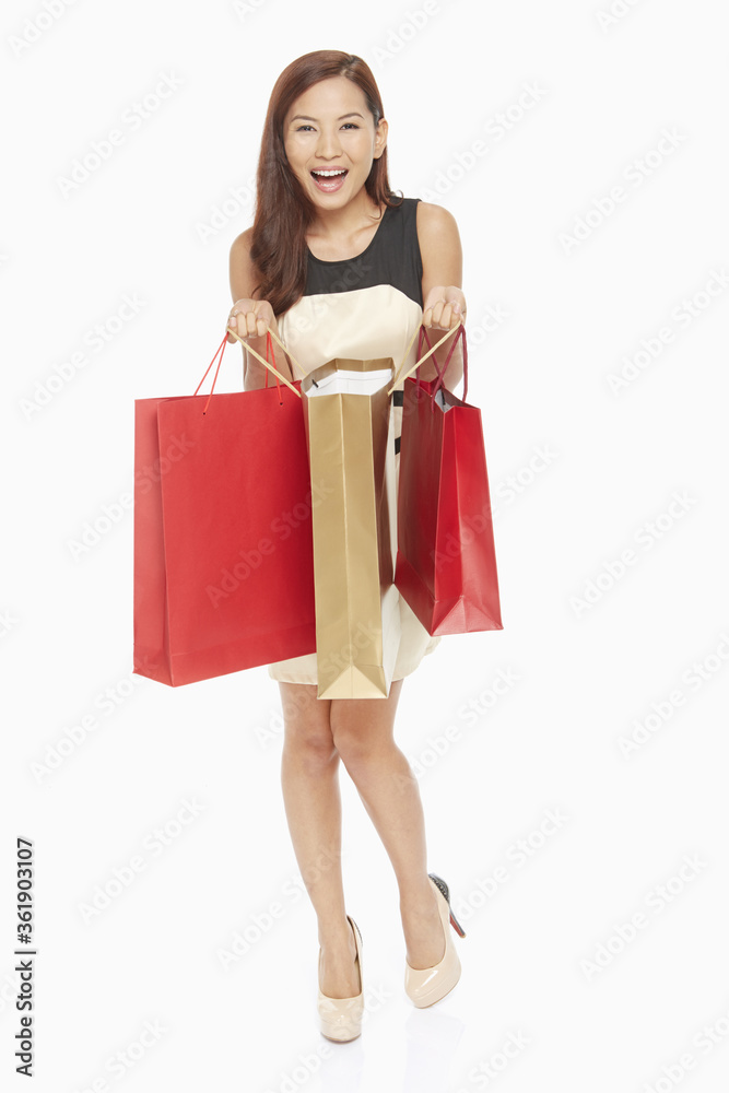 Woman holding up her shopping bags