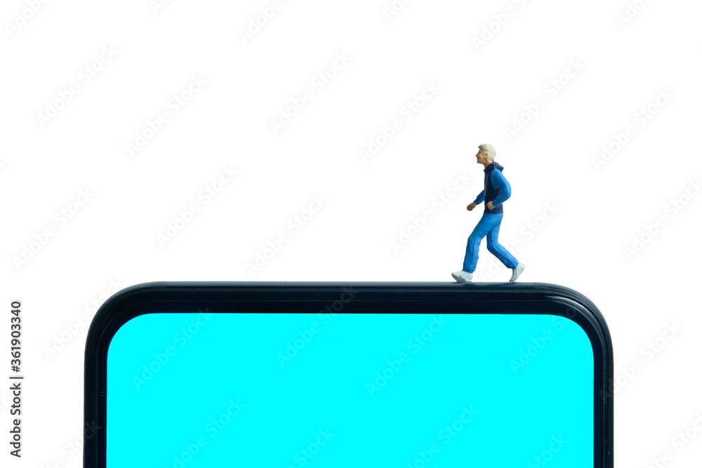 Running and jogging tracking app concept. A men running above smartphone. Miniature people figure photography. Running and jogging tracking app concept. A men running above smartphone. Miniature people figure photography.