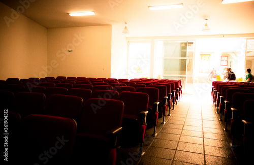 auditorium red chairs beige background interior  