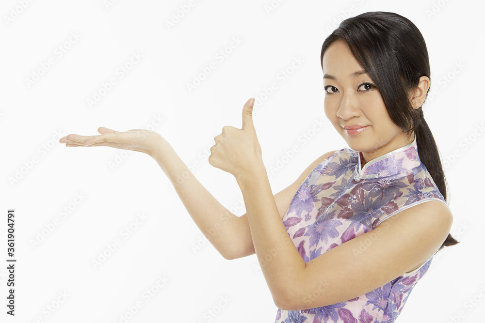 Woman in traditional clothing showing hand gesture Woman in traditional clothing showing hand gesture