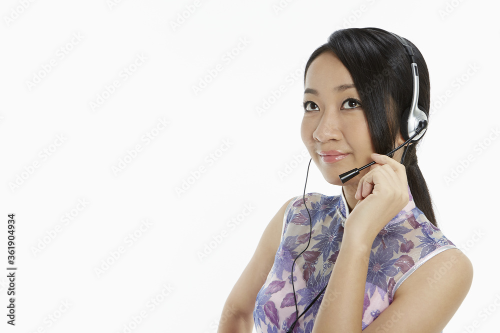 Woman in traditional clothing with a headset Woman in traditional clothing with a headset