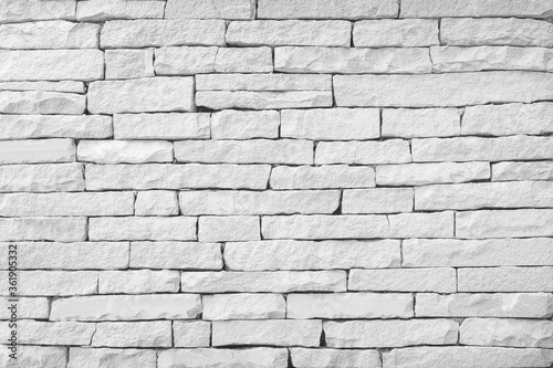 Surface white wall of stone wall gray tones for use as background.