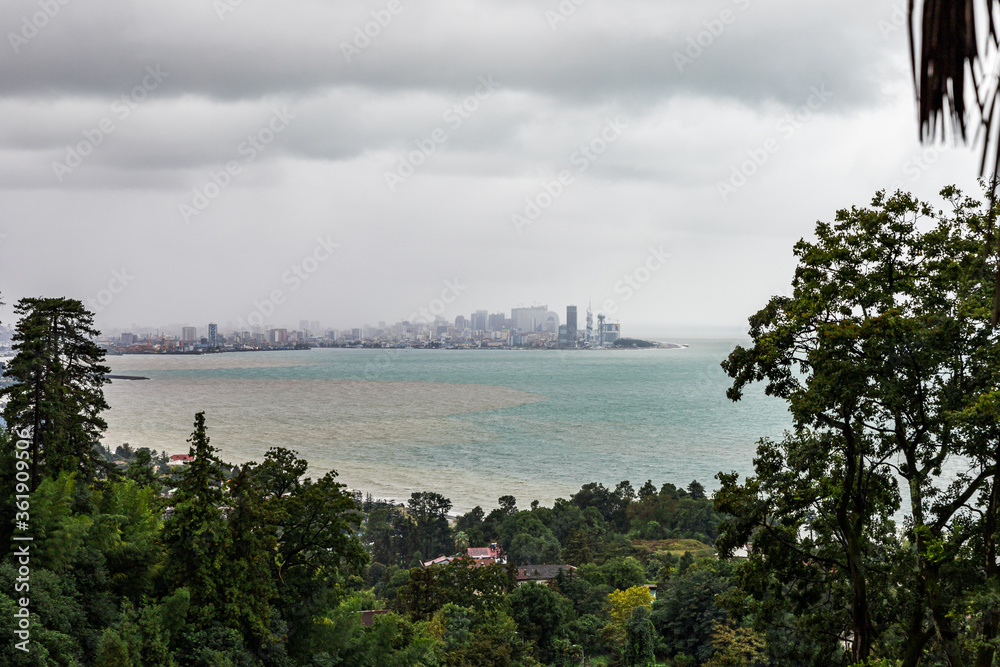 View on a rainy day from the Batumi Botanical Garden to the Black Sea Bay and Batumi city in Georgia