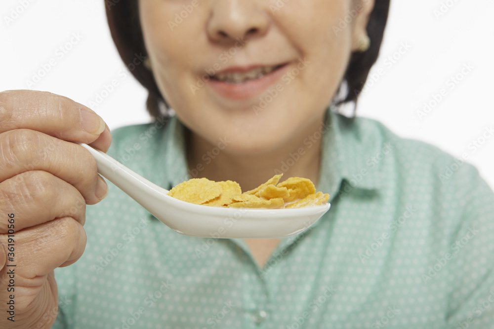 Woman having cereals for breakfast Woman having cereals for breakfast