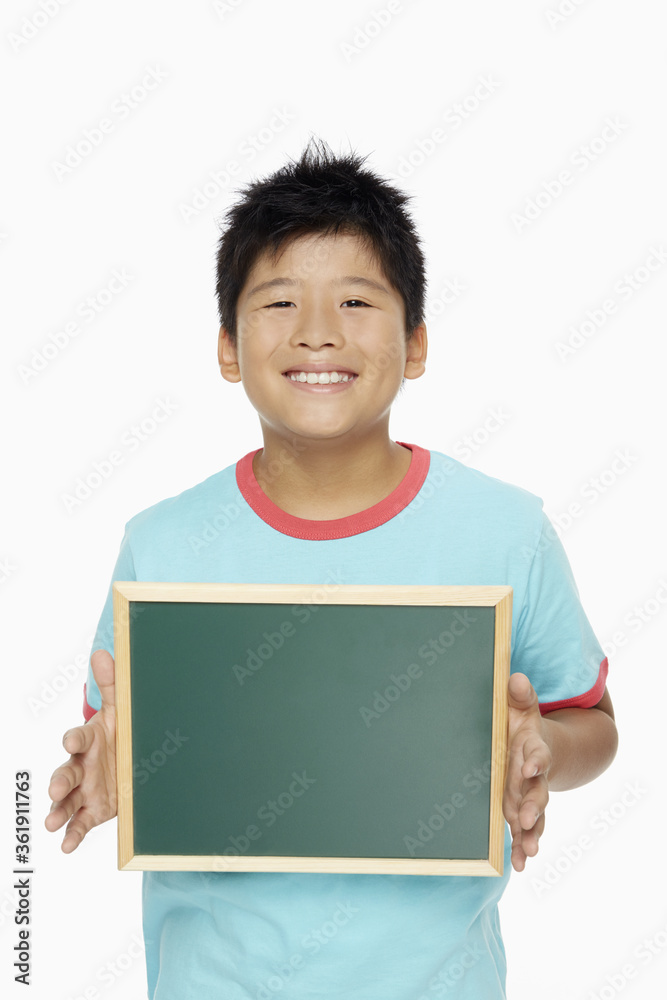 Boy holding up a blackboard Boy holding up a blackboard