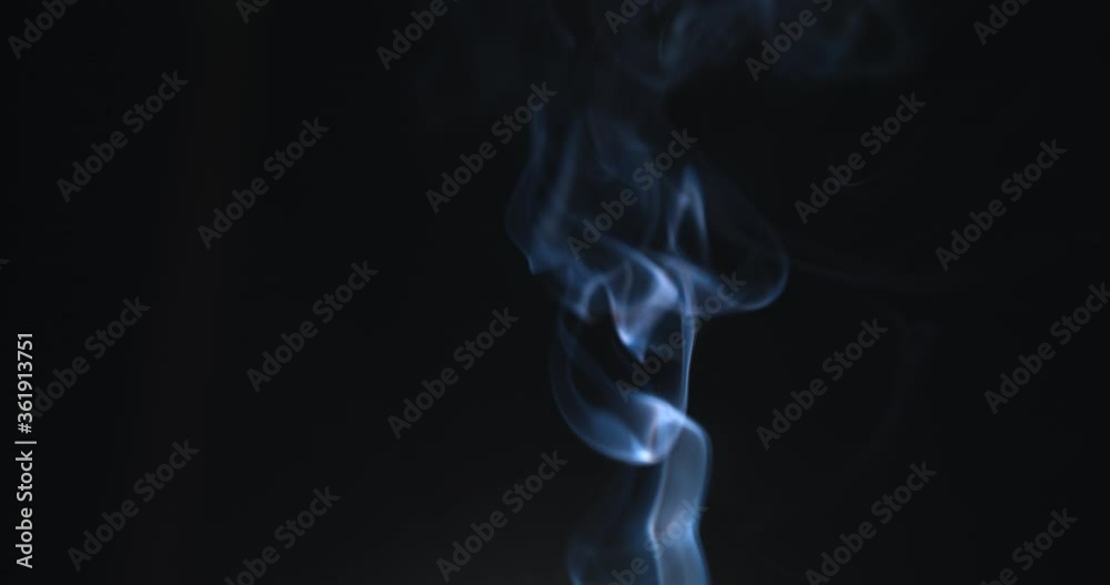 Atmospheric smoke 4K Fog effect. Smoke in slow motion on black background. White smoke slowly floating through space against black background Atmospheric smoke 4K Fog effect. Smoke in slow motion on black background. White smoke slowly floating through space against black background