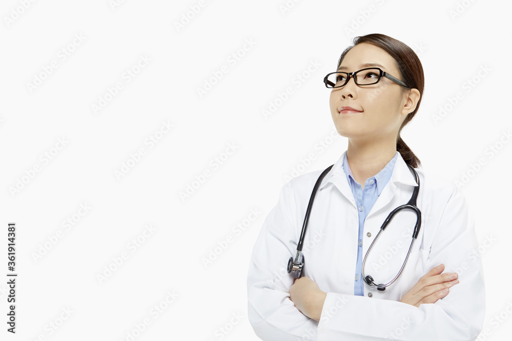 Medical personnel with arms crossed, smiling