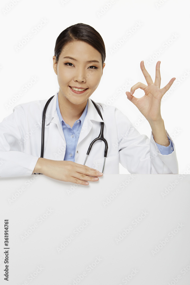 Cheerful medical personnel showing hand gesture Cheerful medical personnel showing hand gesture