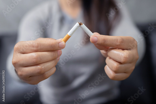 Stop smoking. The concept of girls holding cigarettes in their hands Happy women who quit smoking cessation of bad habits health care concepts do not smoke
