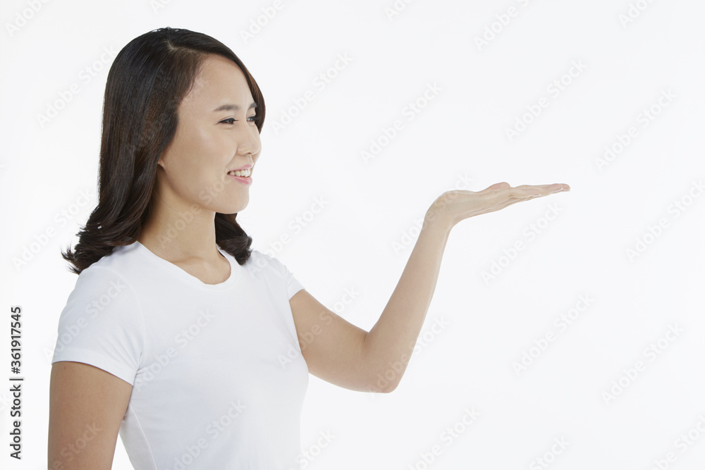 Woman smiling and showing hand gesture Woman smiling and showing hand gesture