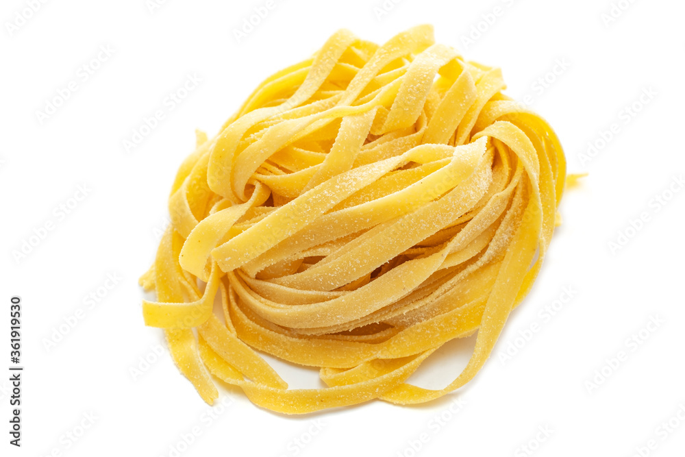 Fresh colored egg pappardelle pasta isolated on a white background Fresh colored egg pappardelle pasta isolated on a white background