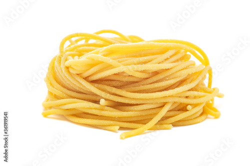 Fresh uncooked spaghetti pasta isolated on a white background