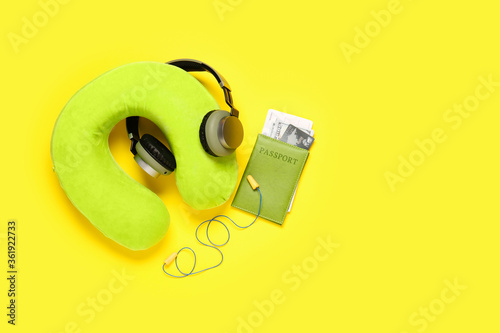 Travel accessories on color background