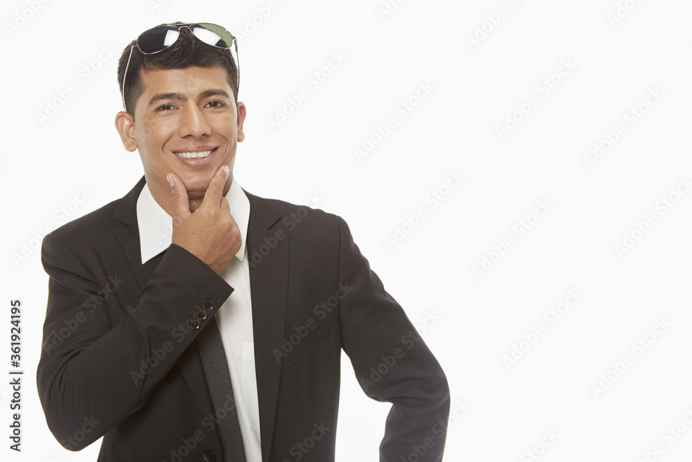 Businessman smiling and showing hand gesture Businessman smiling and showing hand gesture