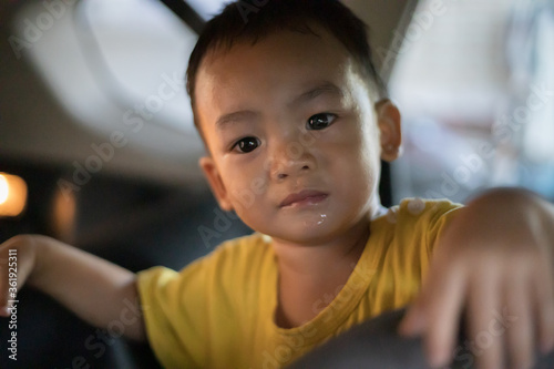 1 Year Old Adorable Asian Boy Playing and Looking Around in the Car
