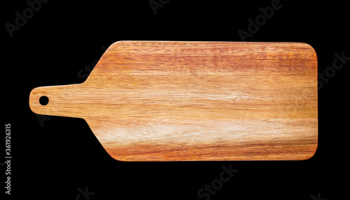 Wooden cutting board isolated on black