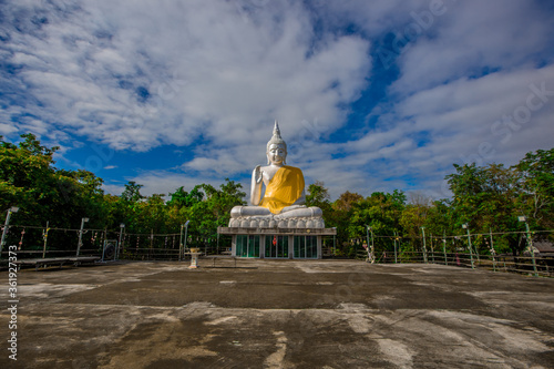 Background of the important religious sites in Udon Thani (Wat Pa Thep Prathanporn) has a large Buddha statue for people or tourists to make merit while traveling in Thailand. photo