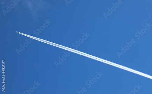 airplane while flying on the blue sky