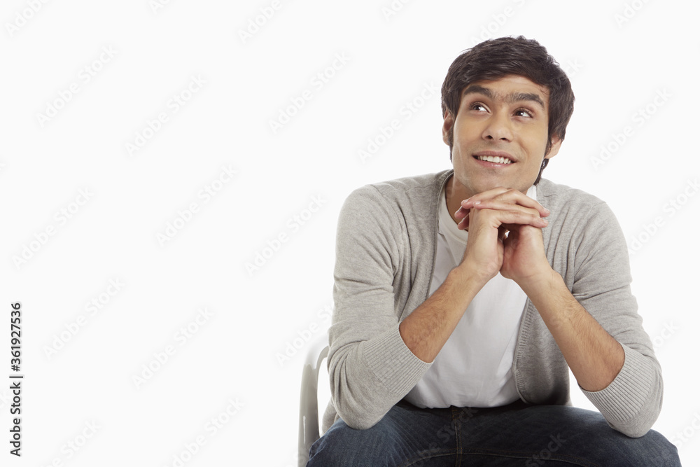Cheerful man sitting on a chair Cheerful man sitting on a chair