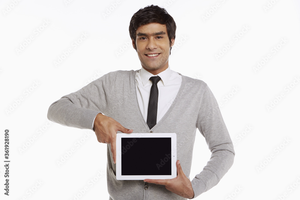 Man holding up a digital tablet