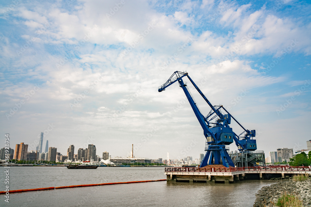 A vintage crane in expo park along the Huangpu river in Shanghai, shot a cloudy day.