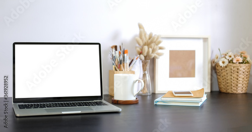 Workspace desk and laptop. copy space and blank screen. Business image, Blank screen laptop and supplies. © wattana