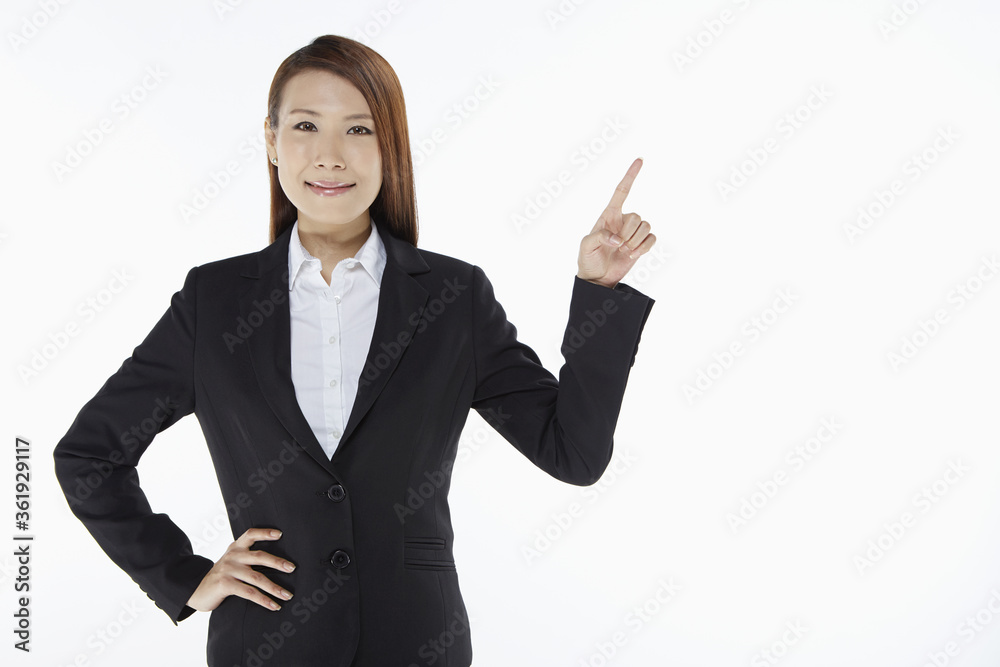 Businesswoman smiling and showing hand gesture Businesswoman smiling and showing hand gesture