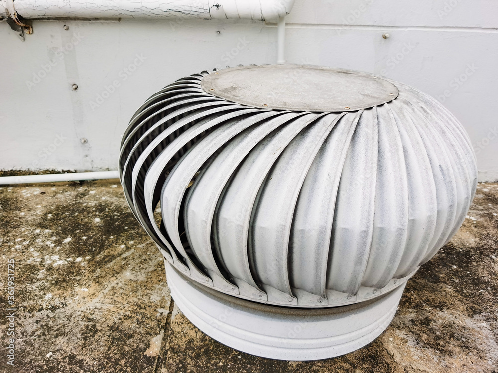 Stainless steel exhaust roof fan on the roof top spinning and take cool