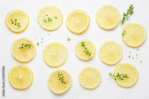 Lemon slices on white background. Top View.  Bright summer pattern