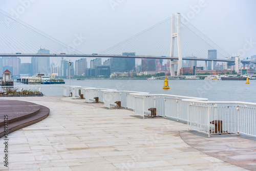 The expo park along the Huangpu River,  with Nanpu bridge in the back, shot in Shanghai, China.