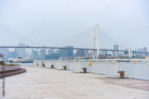 The expo park along the Huangpu River,  with Nanpu bridge in the back, shot in Shanghai, China.