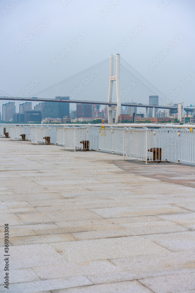The expo park along the Huangpu River,  with Nanpu bridge in the back, shot in Shanghai, China.
