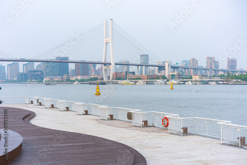 The expo park along the Huangpu River,  with Nanpu bridge in the back, shot in Shanghai, China.