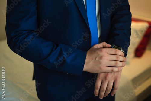 Wrist Watch, man in a jacket, man in a jacket, man watches time, the groom watches the time, wedding day, groom's fees