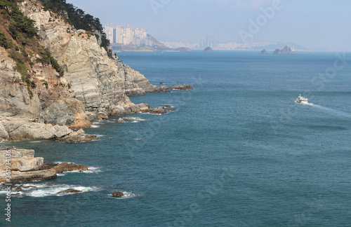 Rocky coastline and magnificent cliffs at Taejongdae recreational park, Busan, South Korea photo