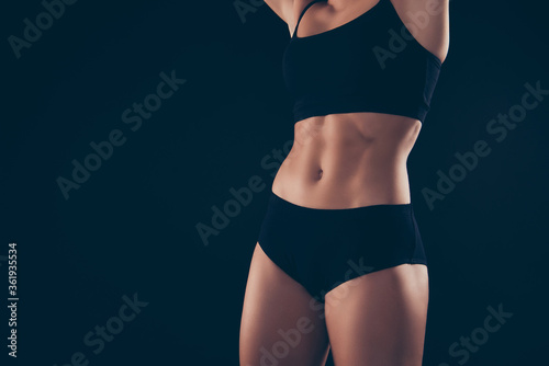 Cropped closeup photo short sport suit lady amazing ideal figure stomach wait start training isolated black dark background © deagreez
