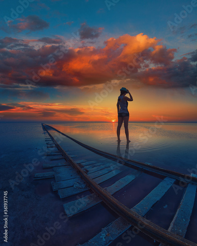 Woman at beauty sunset on s...