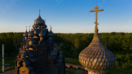 Wooden ancient Russian temple at sunrise. Aerial shot. Theological estate. Bogoslovka. photo