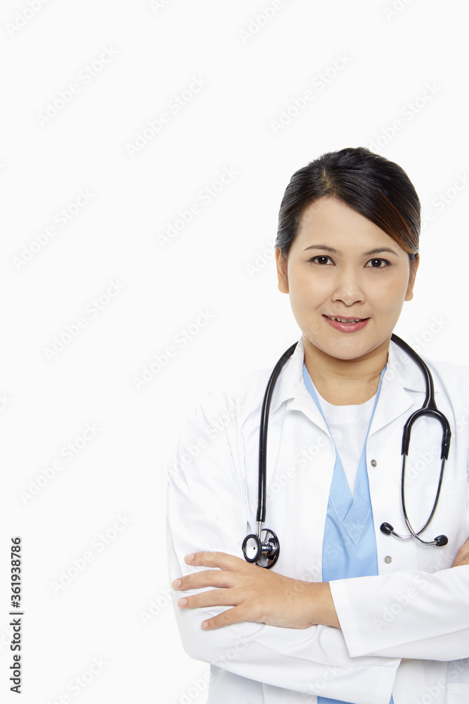 Medical personnel standing with arms crossed, smiling Medical personnel standing with arms crossed, smiling