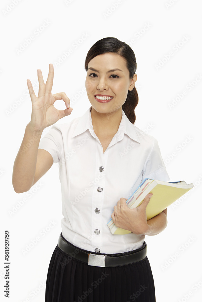 Cheerful woman showing hand gesture Cheerful woman showing hand gesture