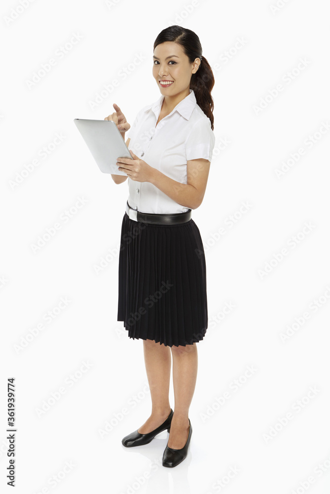 Happy woman using a digital tablet
