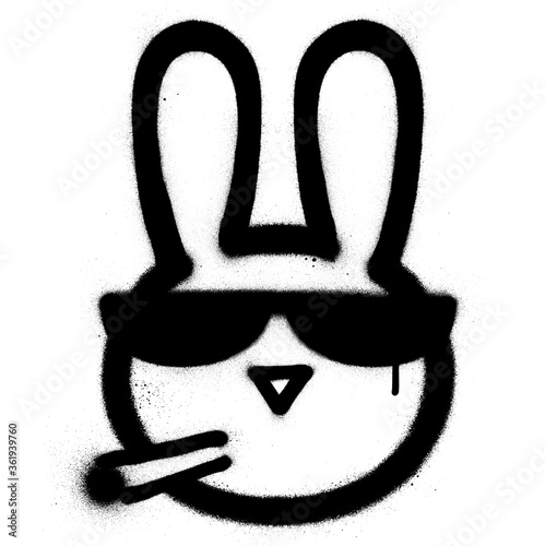 Graffiti smoking rabbit with sunglasses sprayed in black over white