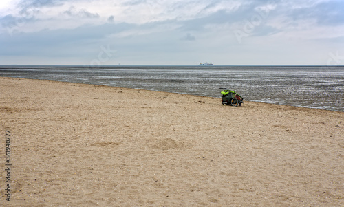 Kinderwagen am Strand bei Schillig und Wattenmeer photo