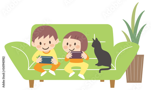 リビングでゲームをする子供たち