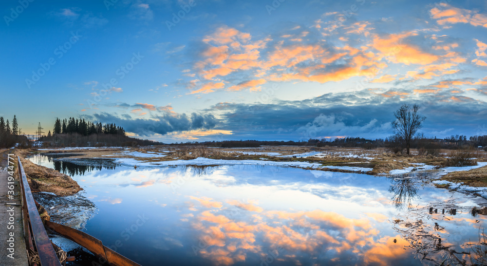 Obraz premium Spring panoramic landscape with river at sunset