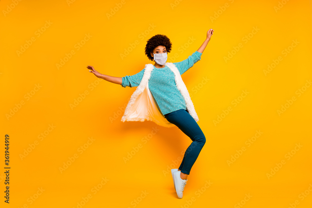Full length body size view of her she nice wavy-haired girl enjoy jumping having fun wearing safety mask dancing stop mers cov prevention healthy life isolated bright color background Full length body size view of her she nice wavy-haired girl enjoy jumping having fun wearing safety mask dancing stop mers cov prevention healthy life isolated bright color background