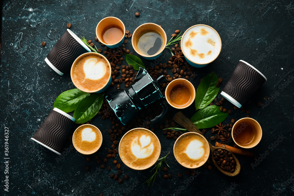 Set of coffee drinks: espresso, cappuccino, latte and Americano. On a black stone background. Top view. Set of coffee drinks: espresso, cappuccino, latte and Americano. On a black stone background. Top view.