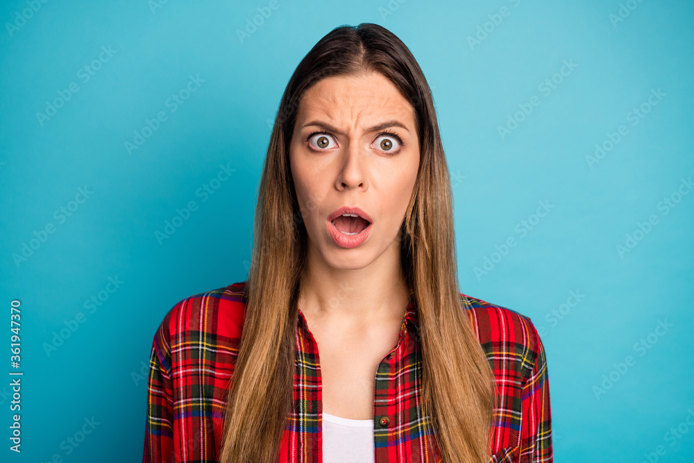 Close-up portrait of her she nice attractive pretty lovely annoyed girl wearing checked shirt bad news reaction isolated on bright vivid shine vibrant blue color background Close-up portrait of her she nice attractive pretty lovely annoyed girl wearing checked shirt bad news reaction isolated on bright vivid shine vibrant blue color background